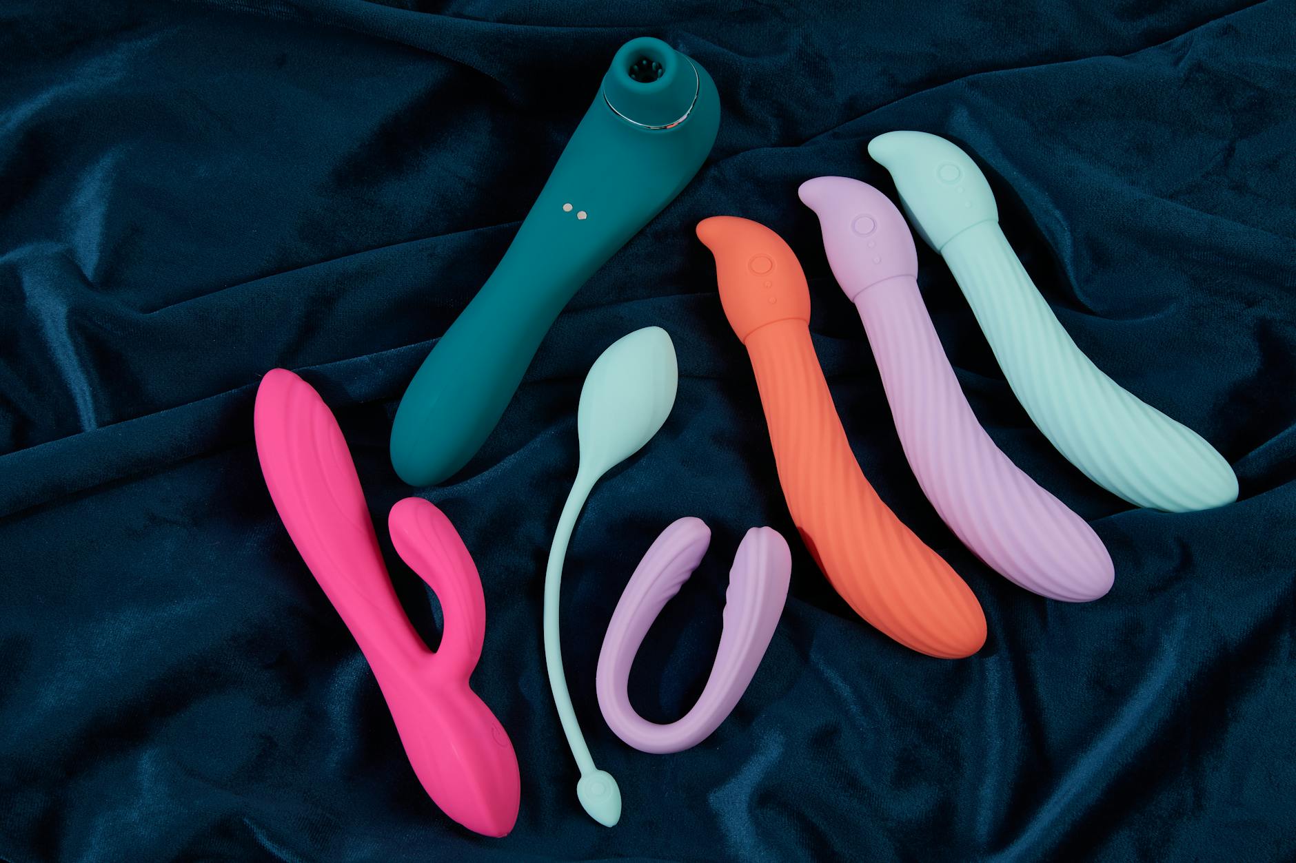 A couple holding a blue vibrator together, demonstrating intimate partner connection