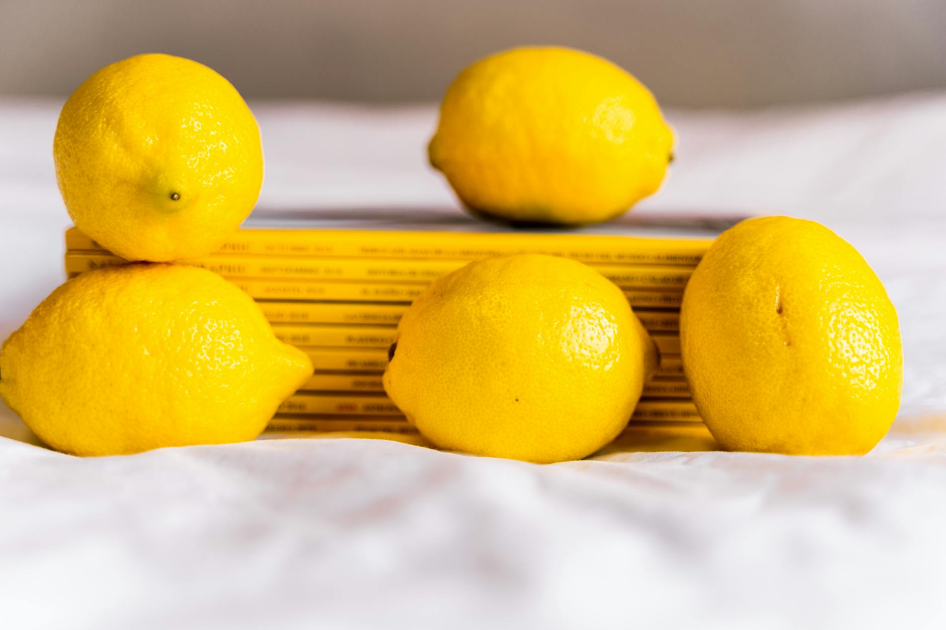 Lemon vibrator and intimate wellness tools arranged thoughtfully on a white surface